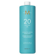 Blue bottle of Moroccanoil oxidative cream developer on a white background