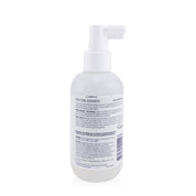 White bottle with pump and label on a white background