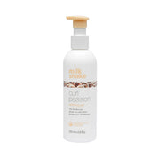 Milk Shake Curl Passion styling gel bottle on a white background