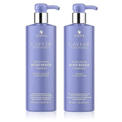 Two bottles of Alterna Caviar Anti-Aging Restructuring Bond Repair Shampoo and Conditioner on a white background