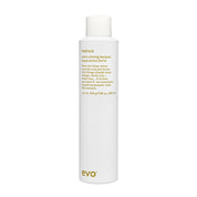 White bottle of evo hair product on a white background