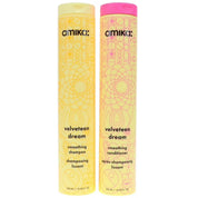 Two bottles of amika velveteen dream smoothing shampoo and conditioner on a white background