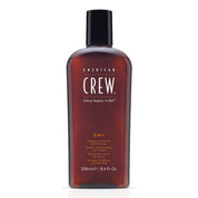 American Crew 3-in-1 shampoo, conditioner, and body wash bottle on a white background