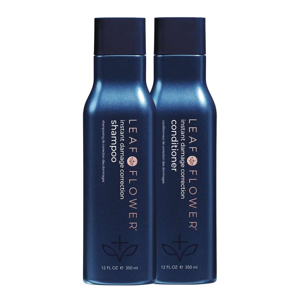 Two blue bottles of LEAF & FLOWER shampoo and conditioner on a white background