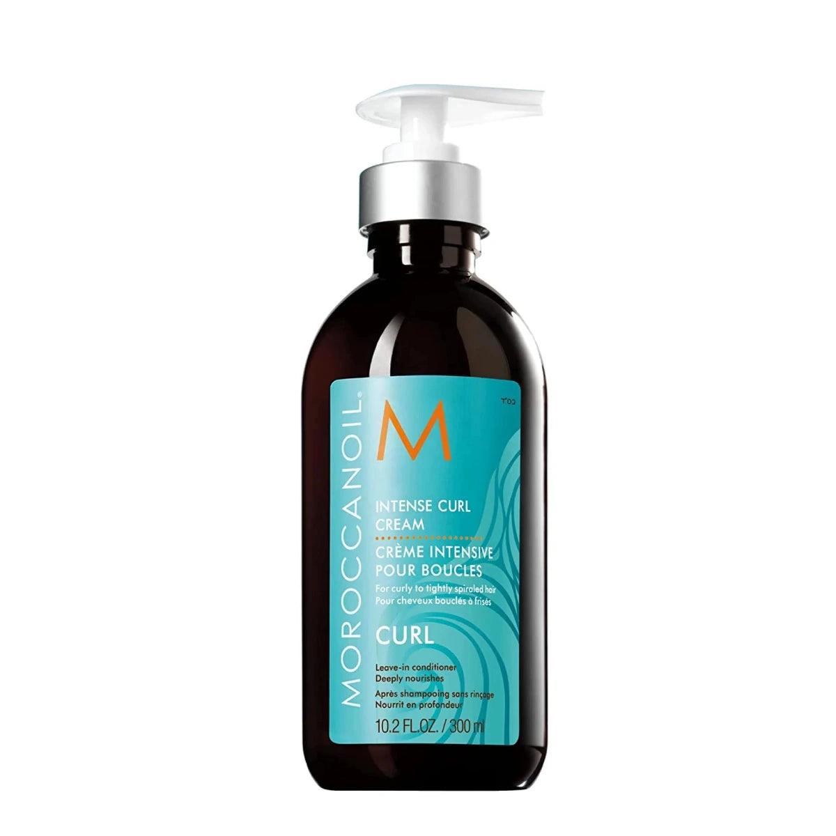 A bottle of Moroccanoil Intense Curl Cream with a pump dispenser, featuring the brand's teal color label on a black background.