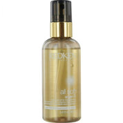 Redken hair oil bottle on a white background