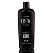 A bottle of American Crew Developer 15 Volume 4.5% in a black container with white and red label, 15.2 oz in size.