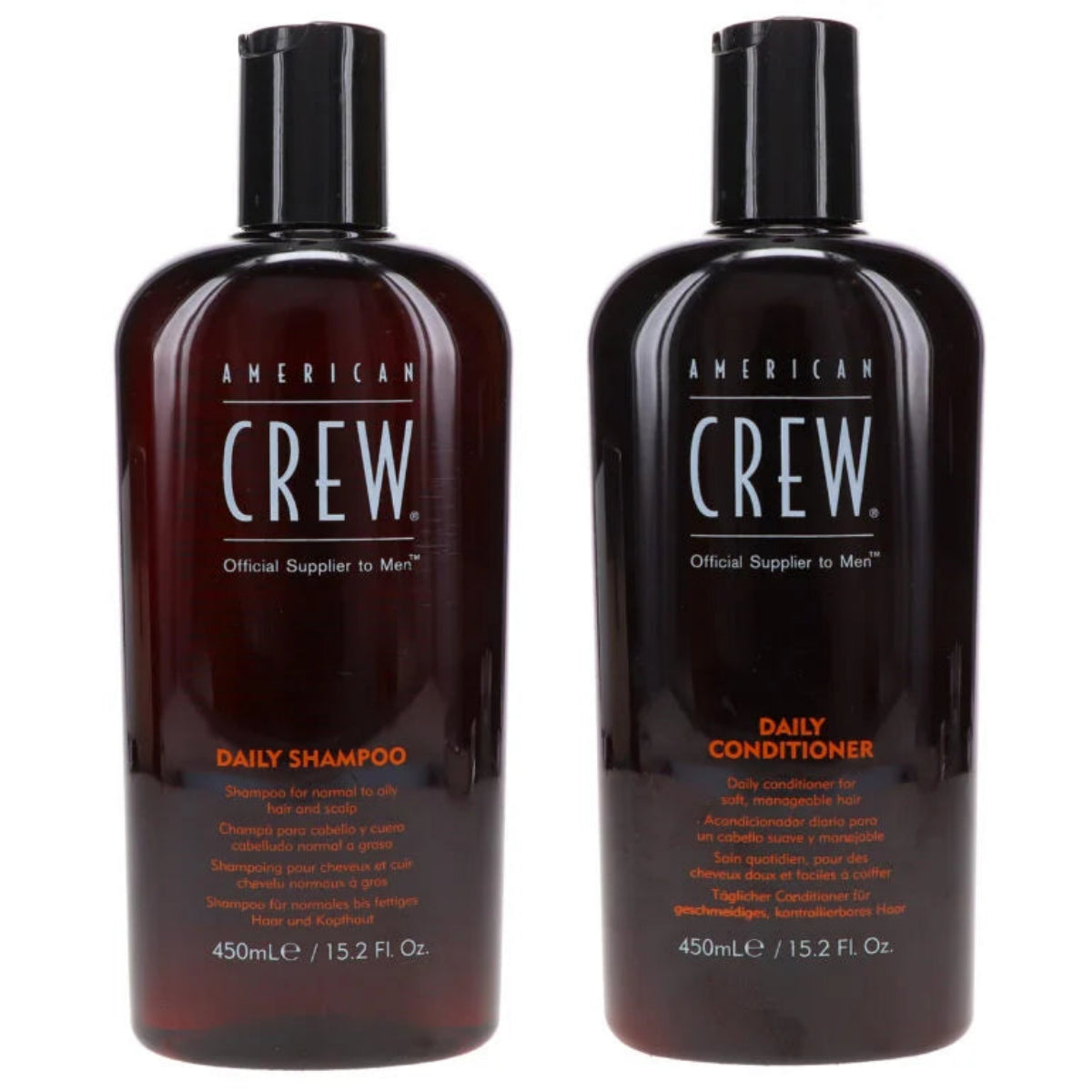 Two bottles of American Crew Daily Shampoo and Conditioner on a white background