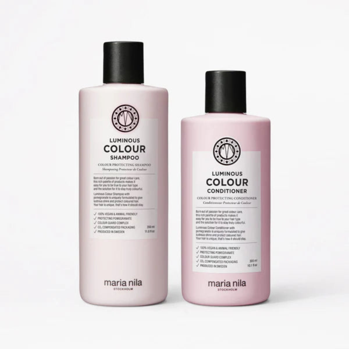 Two bottles of Maria Nila Luminous Colour Shampoo and Conditioner on a white background