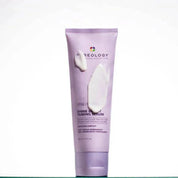 Purple tube of Pureology hair serum on a white background