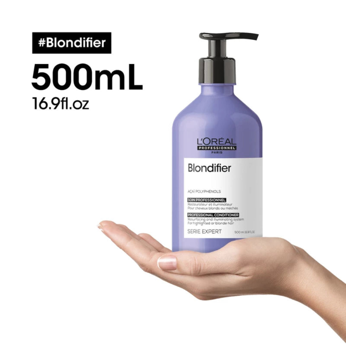 L'Oreal Blondifier hair care product held in a hand with branding and product details.