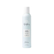 Milk Makeup hair spray bottle on a white background