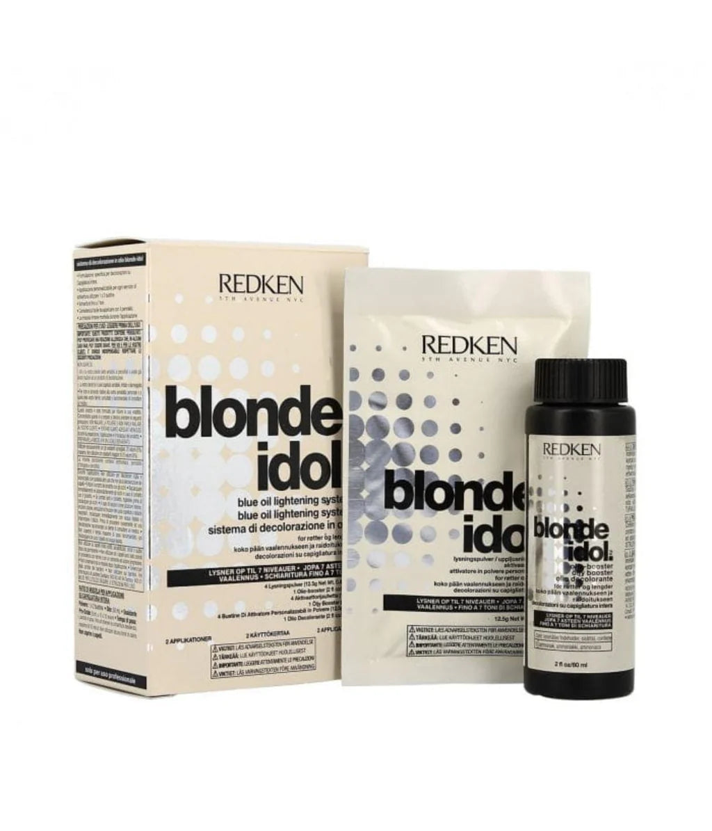 Redken Blonde Idol hair care products including a box, shampoo bottle, and conditioner bottle on a white background.