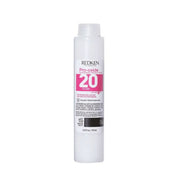 Redken Pro-Oxide hair product on a white background